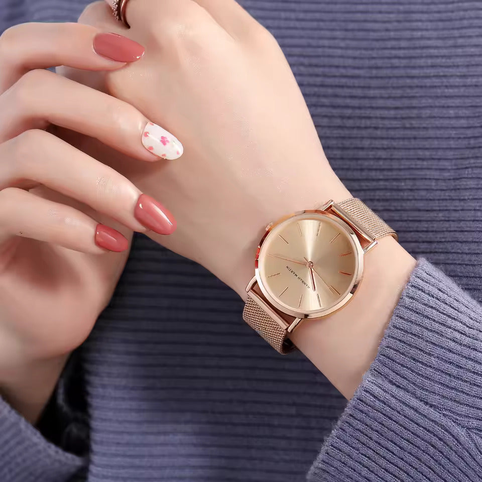 Luxurious Rose Gold Quartz Timepiece Alongside Bracelet