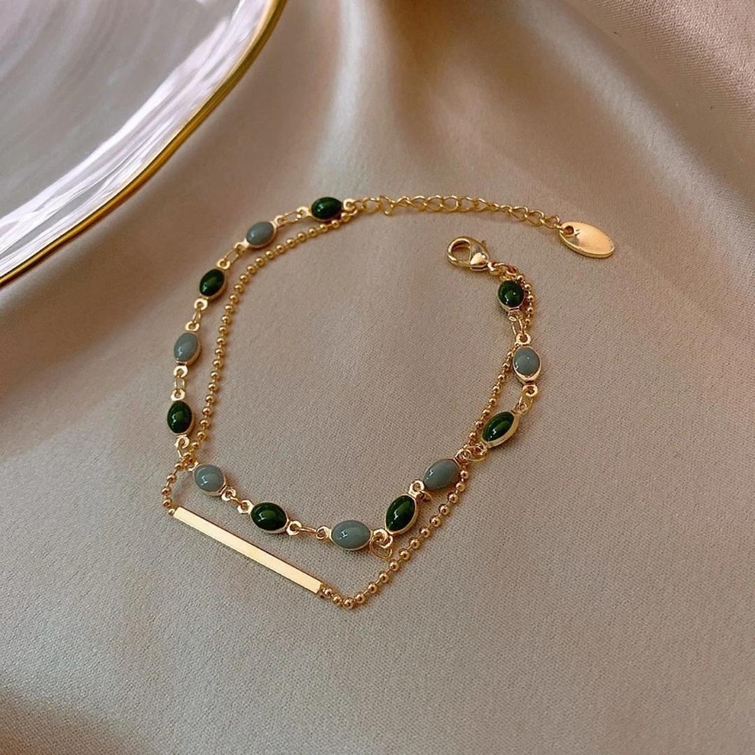 Elegant Gold Bracelet with Precious Green Stone