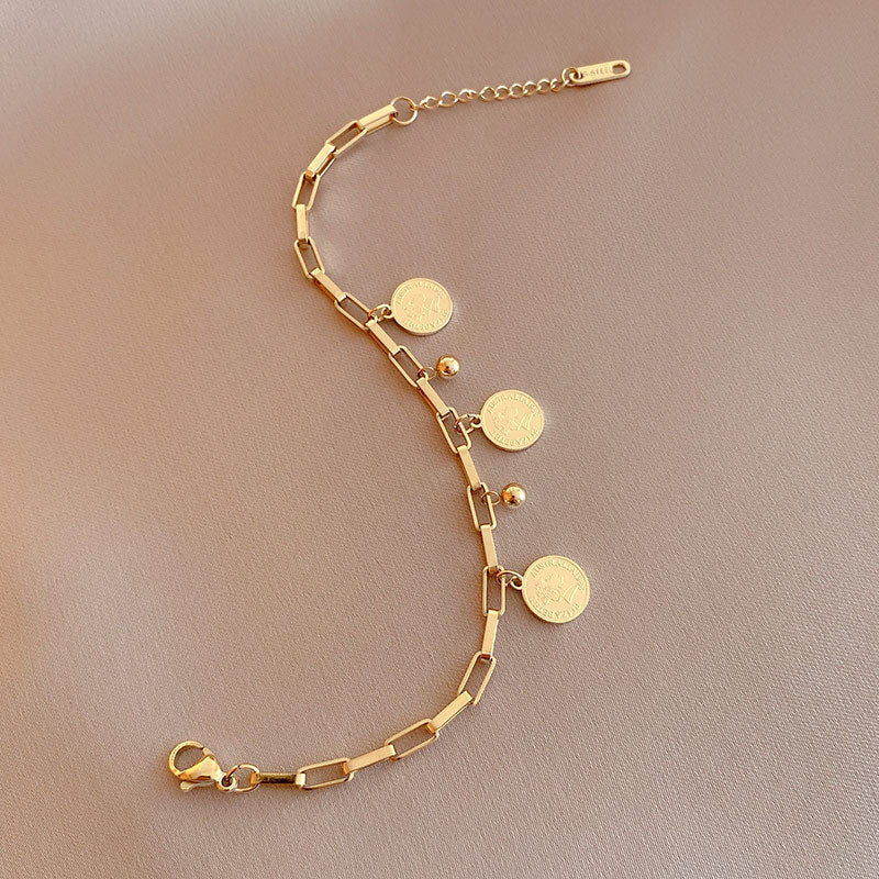 Elegant Adjustable Bracelet with Gold Charms