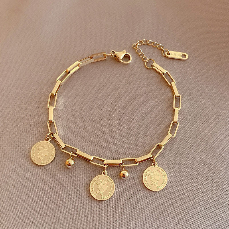 Elegant Adjustable Bracelet with Gold Charms