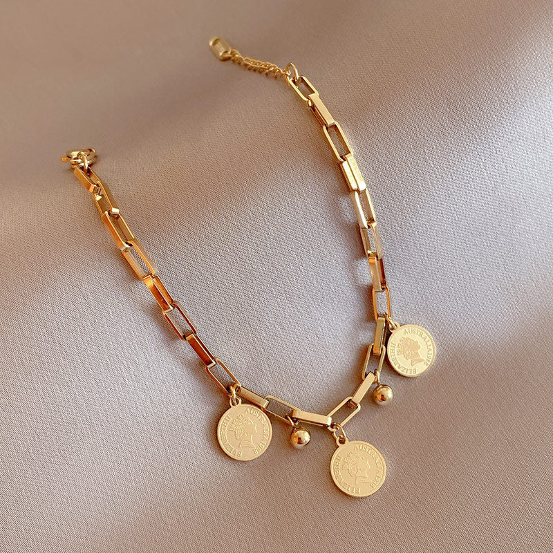 Elegant Adjustable Bracelet with Gold Charms