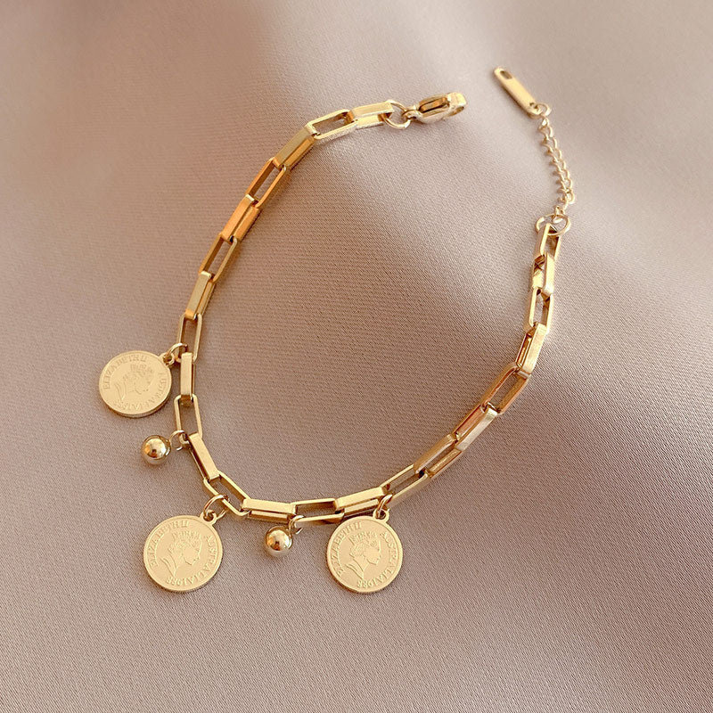 Elegant Adjustable Bracelet with Gold Charms